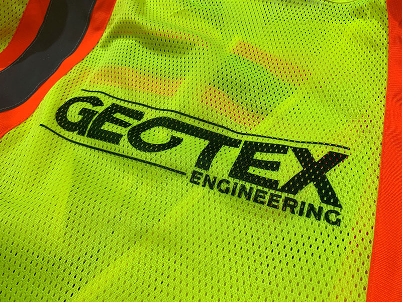 Geotex Vest with logo, showing that they take workplace safety seriously